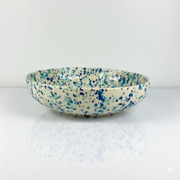Speckled ceramic bowl on a white background